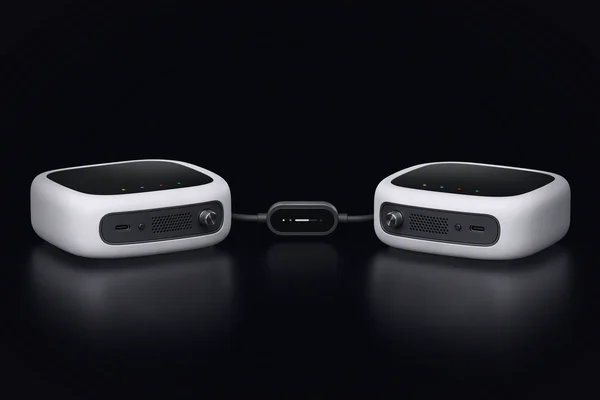 Two small compute nodes facing each other, joined through a small in-line meter