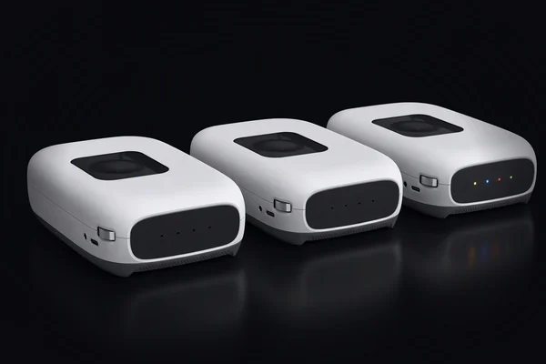 Three compute sleds in a row, two with their lights off and one with its four coloured lights on