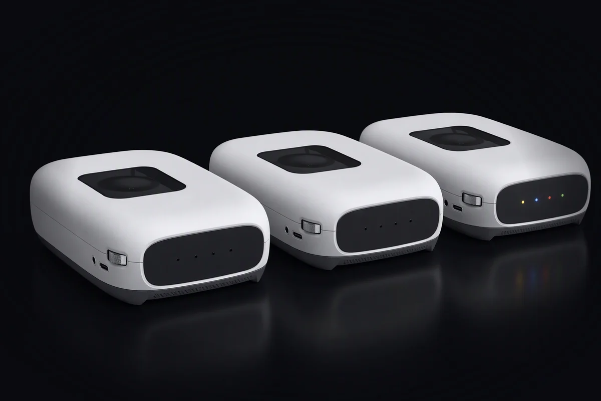 Three compute sleds in a row, two with their lights off and one with its four coloured lights on